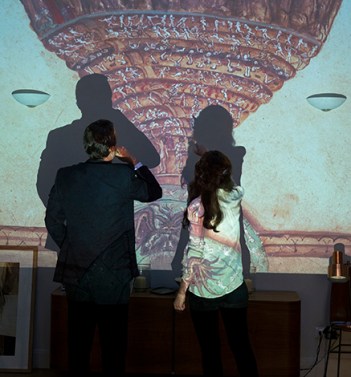 Langdon (Tom Hanks) and Sienna (Felicity Miller) study 'The Map of Hell' 